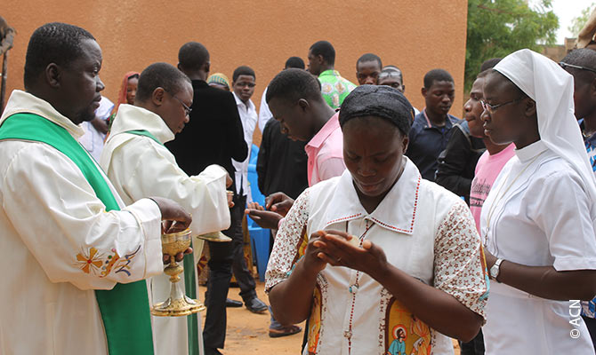 Holy Communion at a camp where young Christians and Muslims live together.