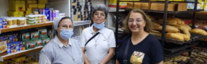 Catholic nuns buying food for poor people